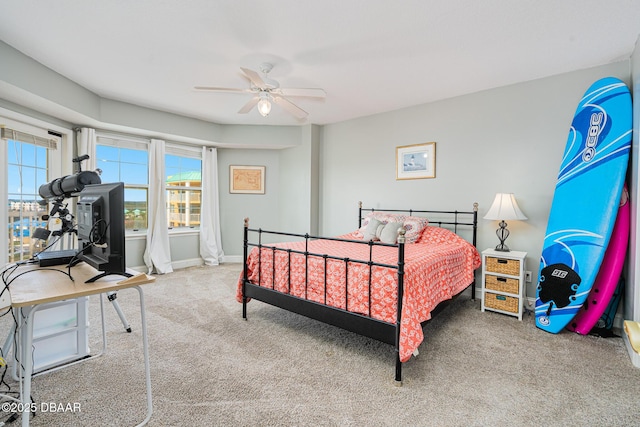 bedroom featuring ceiling fan, carpet floors, and baseboards