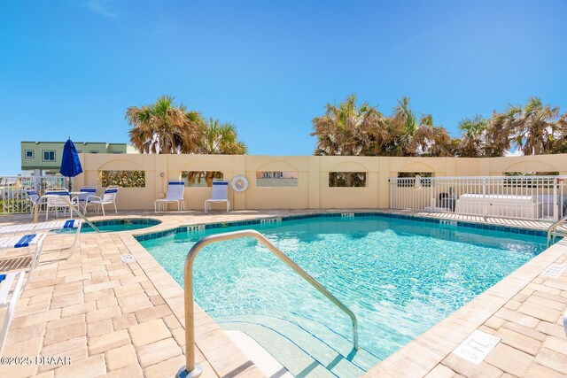 community pool featuring fence