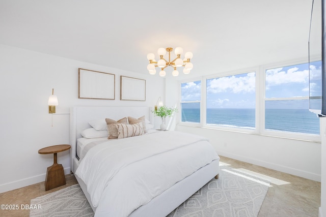 4545 S Atlantic Ave Unit 3604, Ponce Inlet, FL 32127 - bedroom with a chandelier and a water view