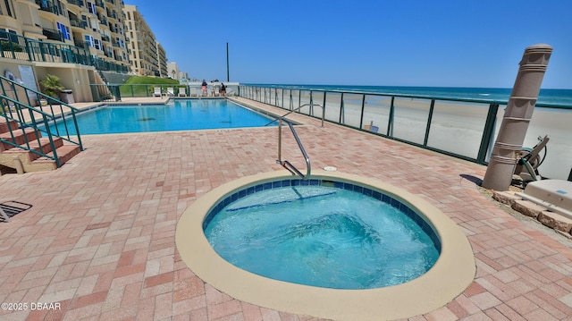 4545 S Atlantic Ave Unit 3604, Ponce Inlet, FL 32127 - community pool featuring a hot tub, a patio, and a water view