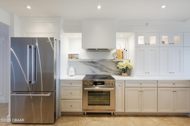 4545 S Atlantic Ave Unit 3604, Ponce Inlet, FL 32127 - kitchen with appliances with stainless steel finishes, light countertops, recessed lighting, and glass insert cabinets