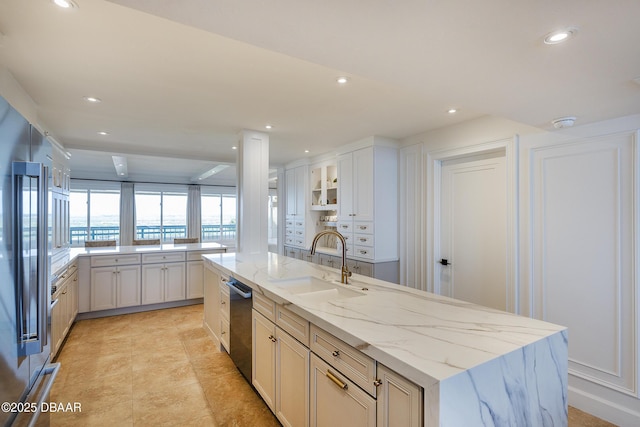 4545 S Atlantic Ave Unit 3604, Ponce Inlet, FL 32127 - kitchen with dishwasher, a kitchen island with sink, recessed lighting, light stone counters, and white cabinets