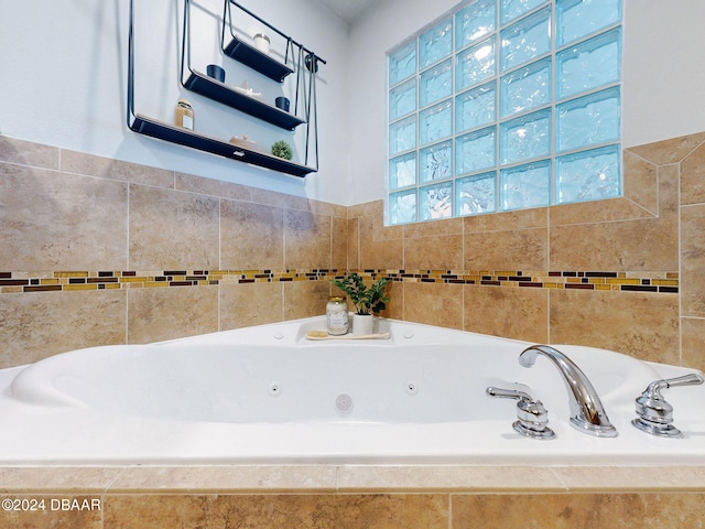 bathroom featuring tiled tub