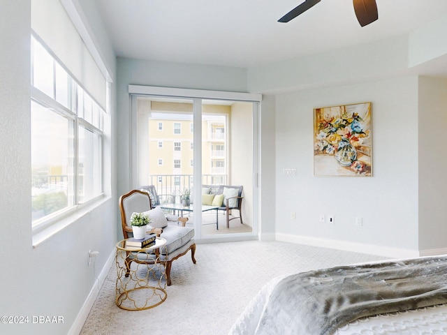 carpeted bedroom with multiple windows and ceiling fan