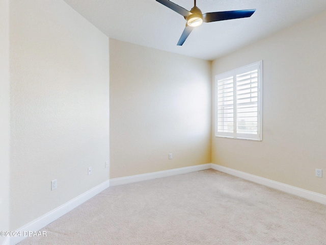 empty room with light carpet and ceiling fan