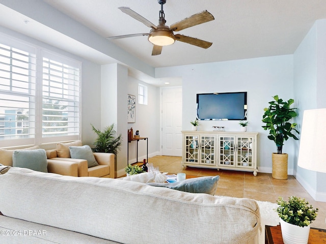 tiled living room featuring ceiling fan