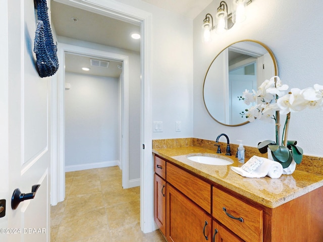 bathroom with tile patterned floors and vanity