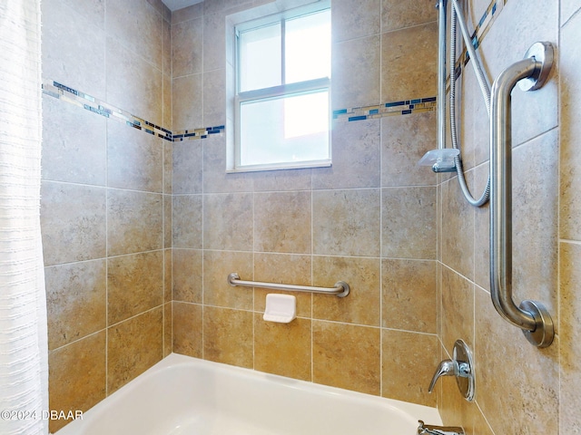 bathroom with shower / tub combo with curtain