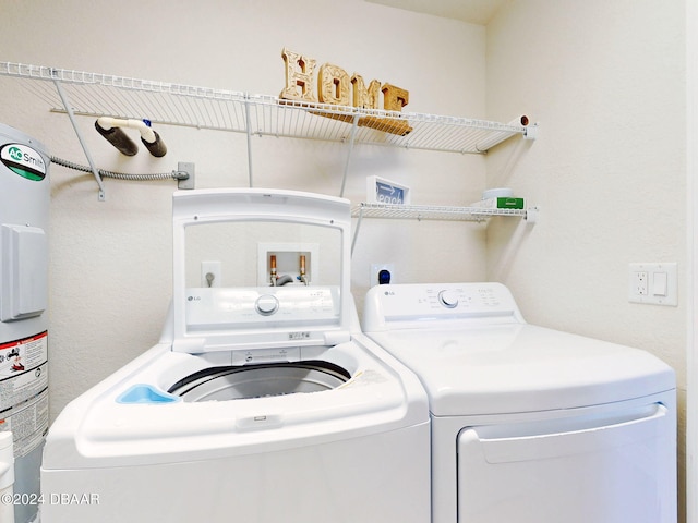 washroom featuring washer and clothes dryer