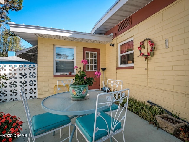 view of patio featuring outdoor dining area