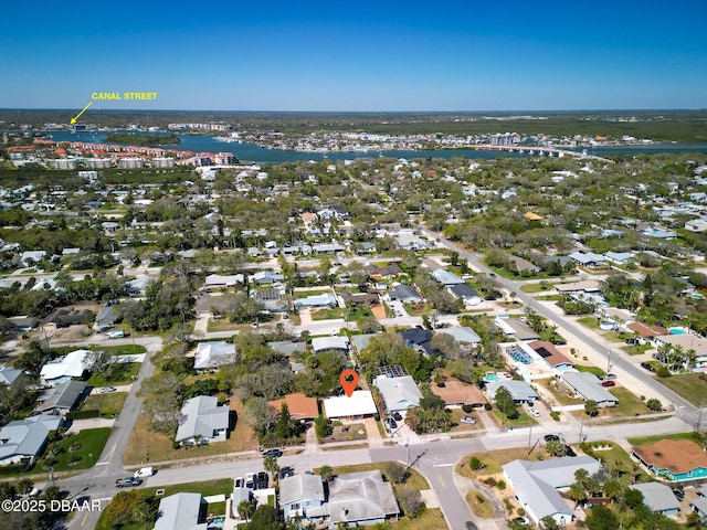 birds eye view of property featuring a water view and a residential view