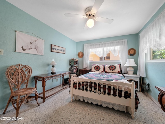 bedroom featuring speckled floor and a ceiling fan