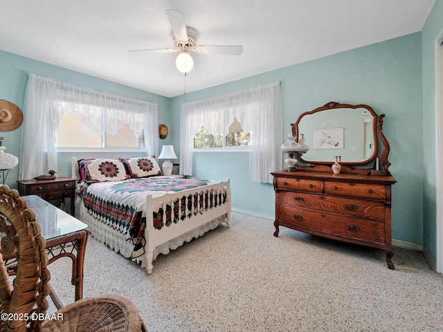 bedroom with baseboards and ceiling fan