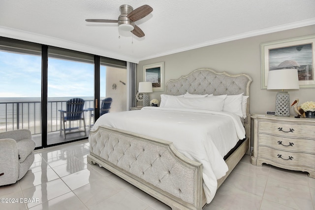 bedroom featuring access to exterior, ceiling fan, a wall of windows, crown molding, and light tile patterned flooring