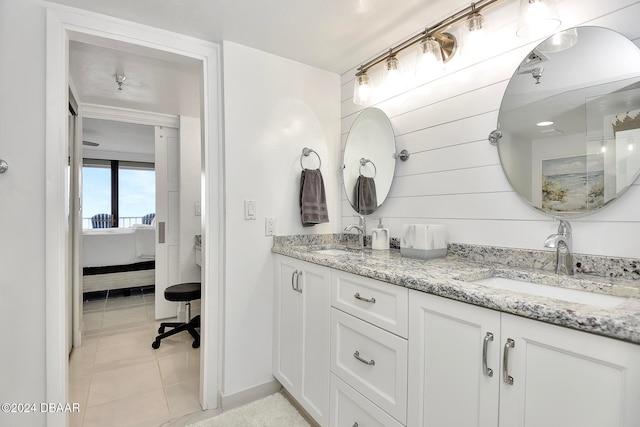 bathroom with tile patterned floors and vanity