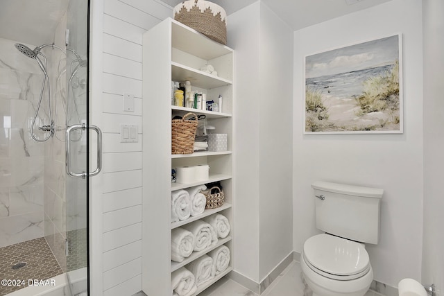 bathroom featuring toilet and walk in shower