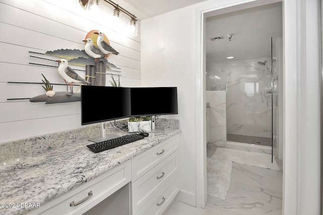 bathroom featuring vanity and an enclosed shower