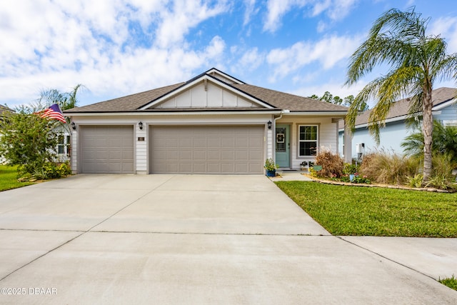 ranch-style home featuring an attached garage, a front lawn, board and batten siding, and concrete driveway