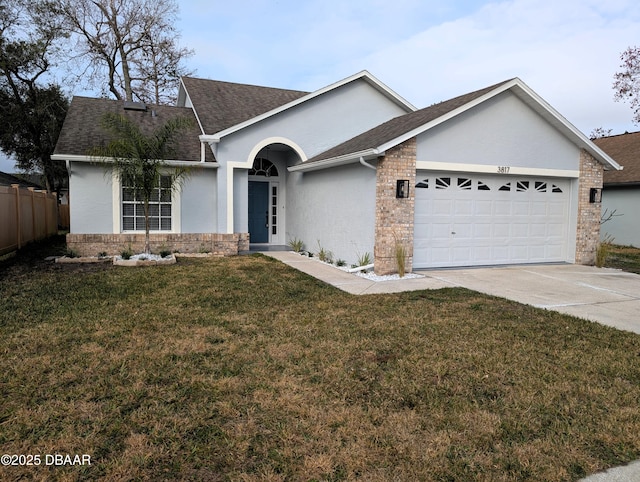 ranch-style house featuring a garage and a front yard