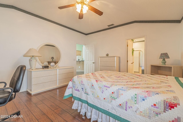 bedroom featuring ornamental molding, lofted ceiling, dark hardwood / wood-style floors, and ceiling fan