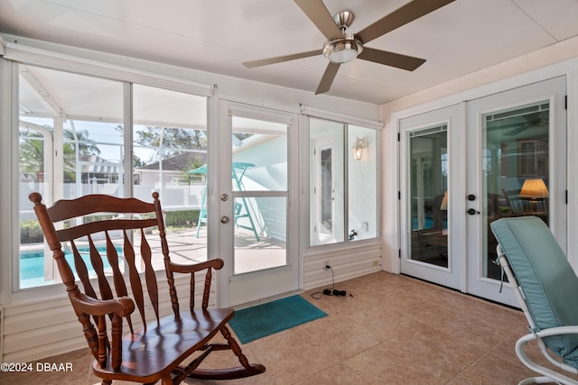 sunroom / solarium with french doors and ceiling fan