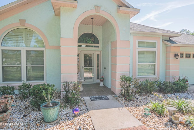 doorway to property featuring a garage