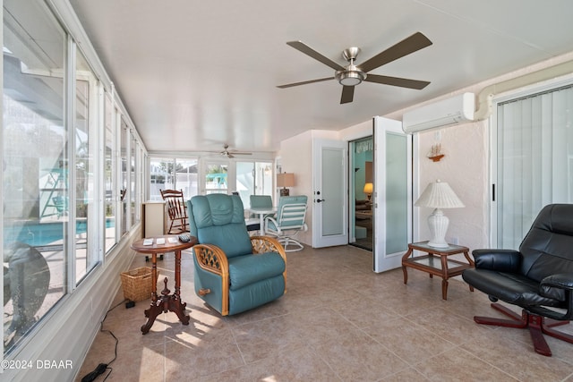 sunroom featuring a wall mounted AC and ceiling fan