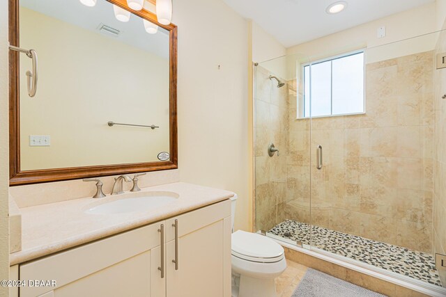 1925 S Atlantic Ave Unit 806, Daytona Beach Shores, FL 32118 - full bathroom featuring a stall shower, toilet, vanity, and recessed lighting