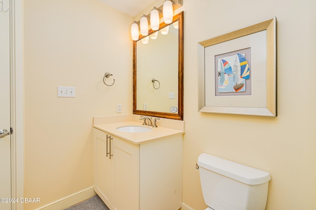 bathroom featuring toilet and vanity