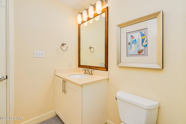 1925 S Atlantic Ave Unit 806, Daytona Beach Shores, FL 32118 - bathroom with vanity, toilet, and baseboards