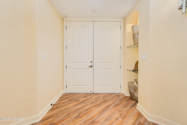 hall with light hardwood / wood-style floors