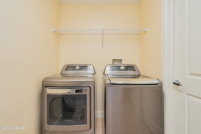 washroom with washer and clothes dryer