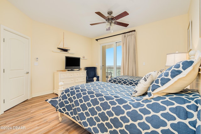 bedroom featuring light hardwood / wood-style flooring, ceiling fan, and access to exterior