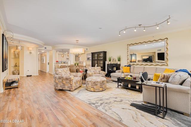 1925 S Atlantic Ave Unit 806, Daytona Beach Shores, FL 32118 - living area featuring ornamental molding, wood finished floors, and a chandelier
