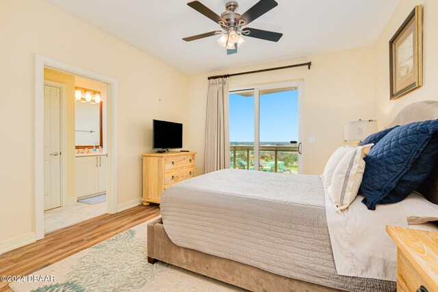 bedroom with ensuite bathroom, access to outside, light hardwood / wood-style flooring, and ceiling fan