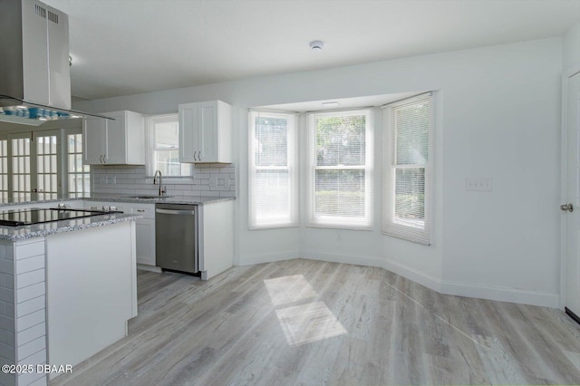 640 Old Treeline Trl, Deland, FL 32724 - kitchen with stainless steel dishwasher, island range hood, light wood finished floors, black electric cooktop, and white cabinetry