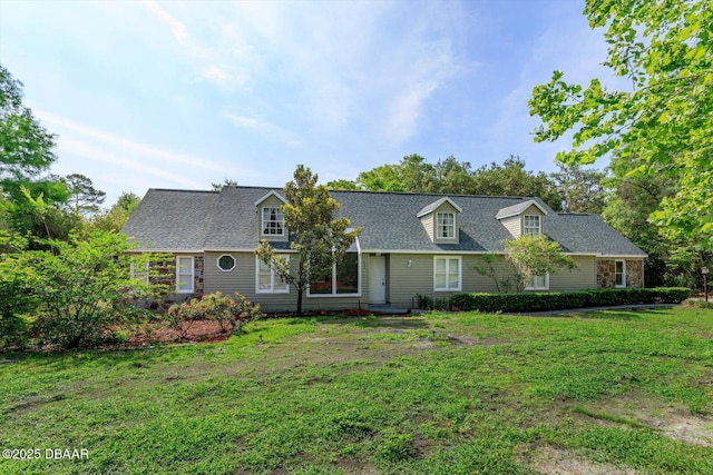 640 Old Treeline Trl, Deland, FL 32724 - new england style home with a front yard and a shingled roof