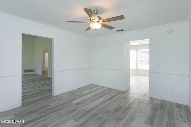 640 Old Treeline Trl, Deland, FL 32724 - empty room with a ceiling fan, ornamental molding, wood finished floors, baseboards, and a smoke detector