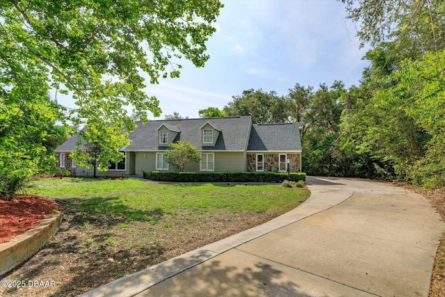 640 Old Treeline Trl, Deland, FL 32724 - new england style home with a front yard and stone siding