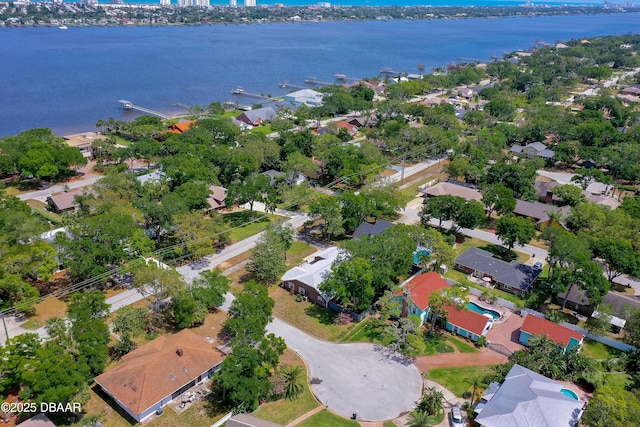 drone / aerial view featuring a water view and a residential view