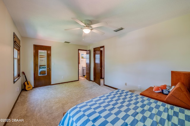 unfurnished bedroom with baseboards, a ceiling fan, visible vents, and carpet floors