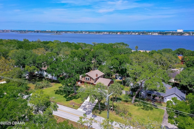 birds eye view of property with a water view