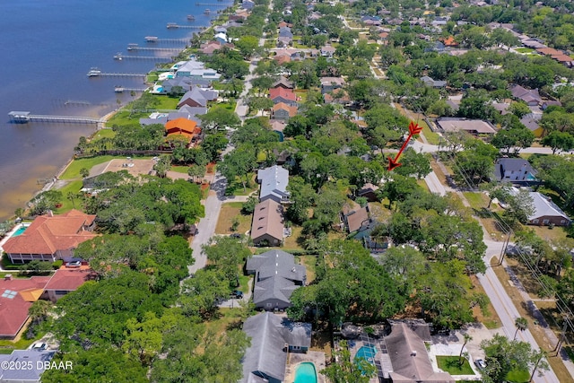 drone / aerial view featuring a water view and a residential view