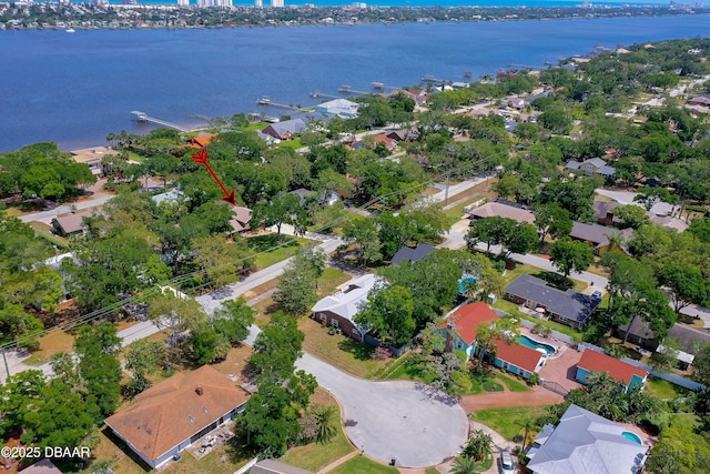 bird's eye view featuring a water view and a residential view