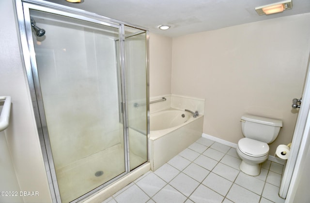 bathroom featuring tile patterned flooring, toilet, and plus walk in shower