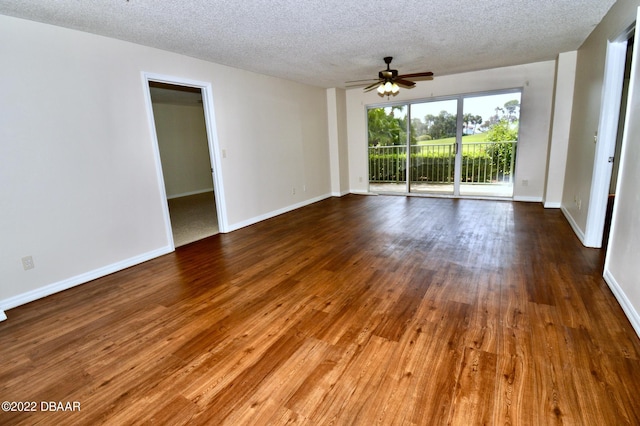 spare room with ceiling fan, a textured ceiling, and hardwood / wood-style flooring