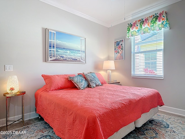 bedroom with baseboards and crown molding