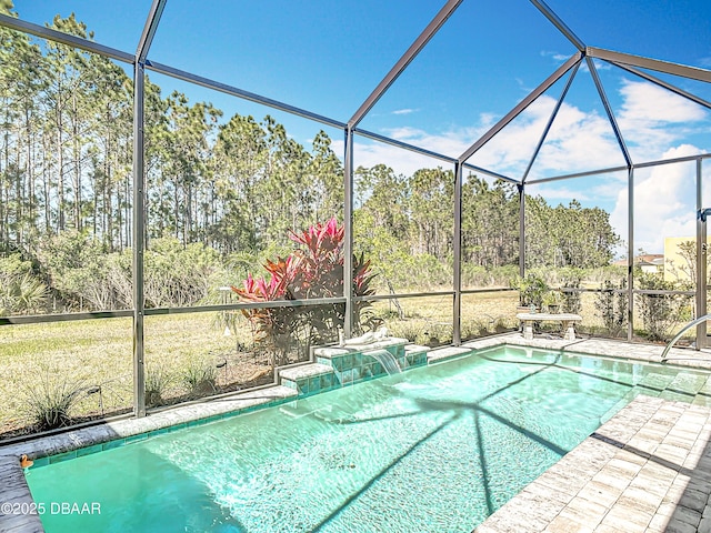 pool featuring a lanai and a patio area