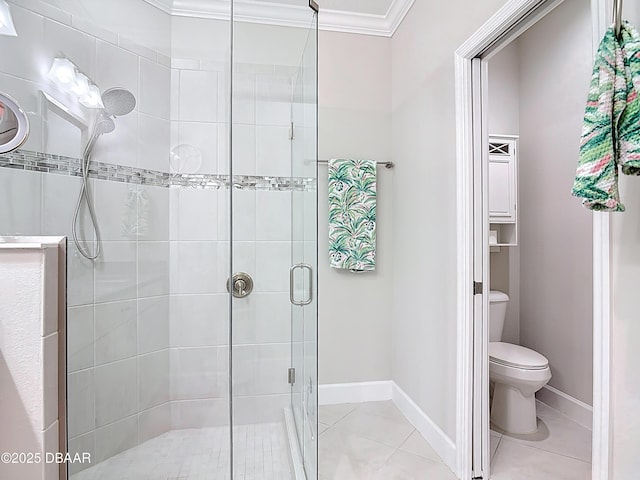 full bathroom featuring tile patterned floors, toilet, a stall shower, crown molding, and baseboards