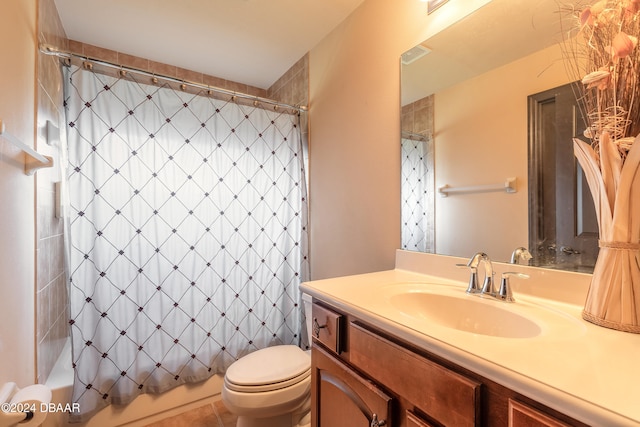 full bathroom featuring tile patterned flooring, vanity, shower / bath combo, and toilet